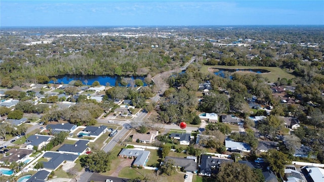 drone / aerial view with a residential view and a water view