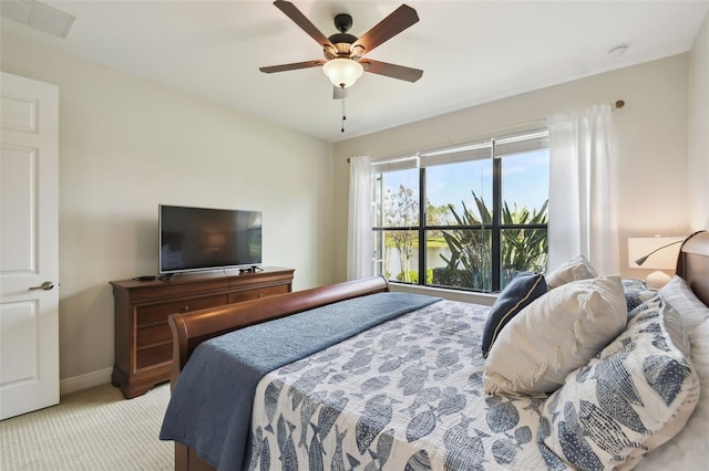 bedroom with carpet, visible vents, baseboards, and a ceiling fan