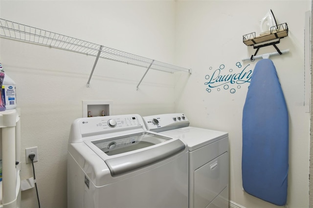 laundry area featuring laundry area and washer and clothes dryer