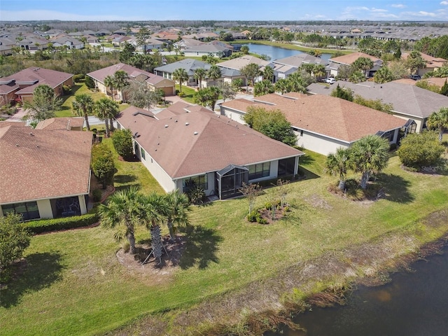 aerial view with a water view and a residential view