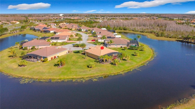 drone / aerial view featuring a water view and a residential view