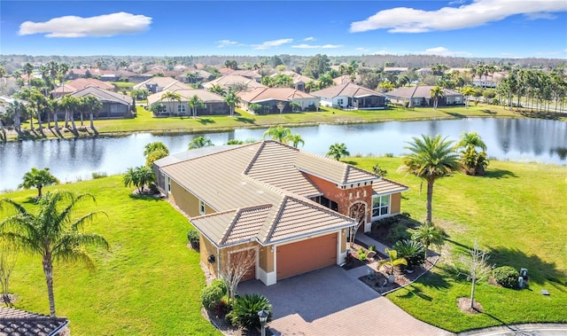 bird's eye view featuring a water view and a residential view