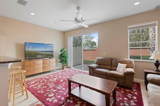 living area with baseboards, ceiling fan, visible vents, and recessed lighting