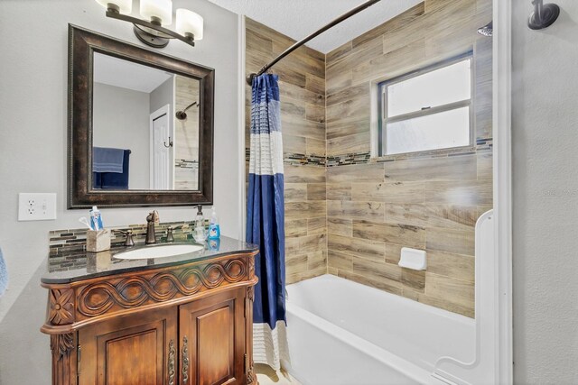 full bathroom with vanity and shower / bath combo with shower curtain