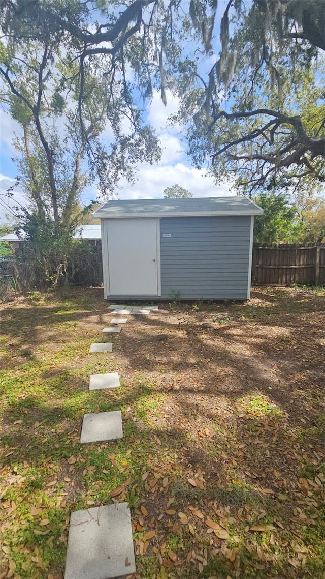 view of shed featuring a fenced backyard