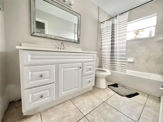 bathroom with tile patterned flooring, shower / bathtub combination with curtain, vanity, and toilet