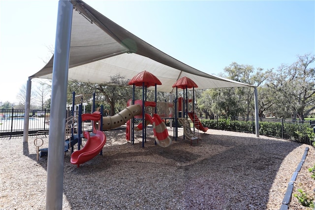 community jungle gym featuring fence