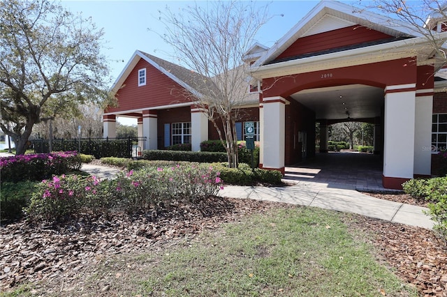 view of front of home featuring fence