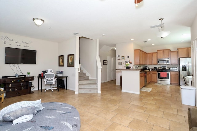 kitchen with visible vents, appliances with stainless steel finishes, open floor plan, and recessed lighting