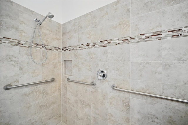 interior space featuring tiled shower