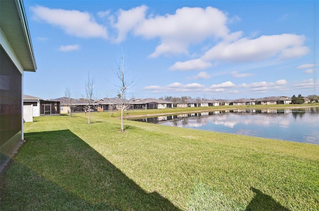 view of yard featuring a water view and a residential view