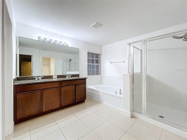 bathroom featuring visible vents, tile patterned flooring, a garden tub, and a shower stall