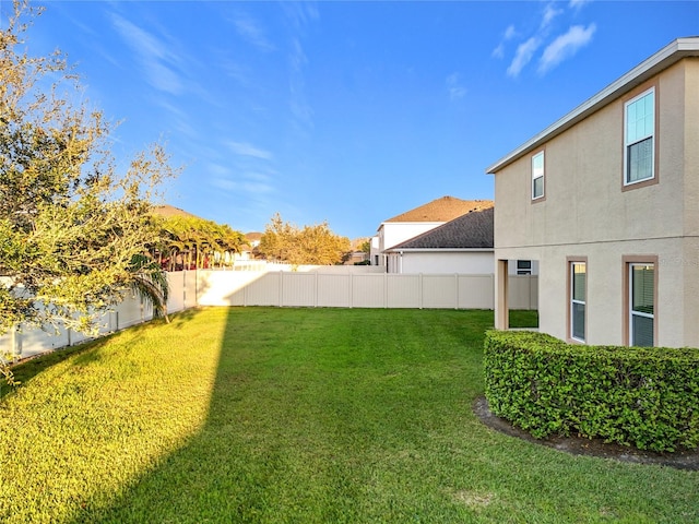 view of yard with a fenced backyard