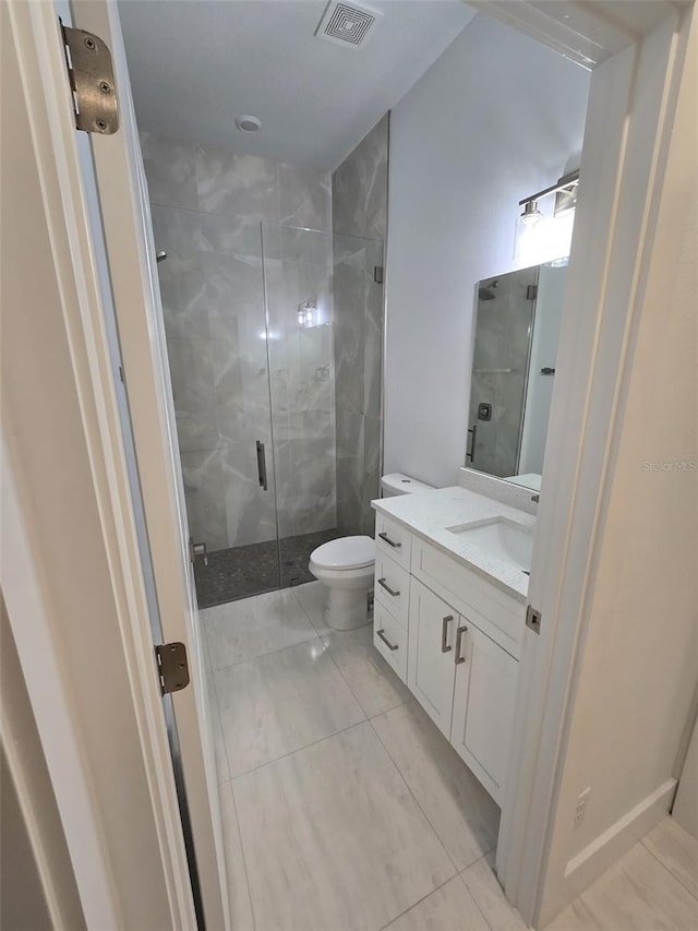 full bathroom with visible vents, a shower stall, vanity, and toilet