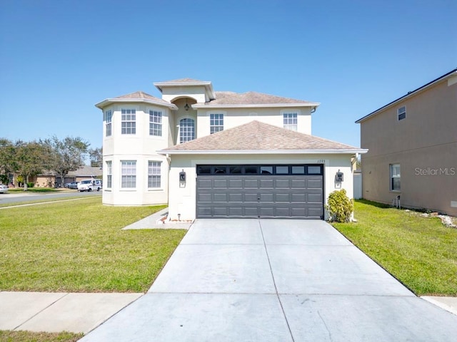 view of front of property with a garage, stucco siding, concrete driveway, and a front yard