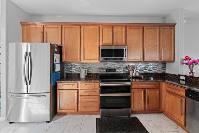 kitchen with brown cabinets, marble finish floor, and stainless steel appliances