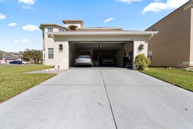 exterior space with a garage, a yard, driveway, and stucco siding