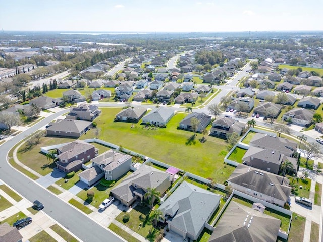 birds eye view of property with a residential view