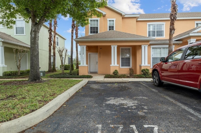 multi unit property with uncovered parking and stucco siding