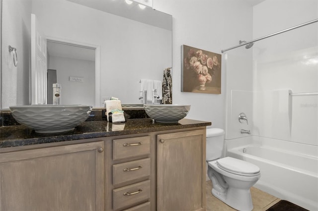 full bath featuring double vanity, toilet, and a sink