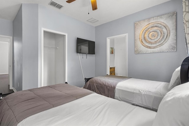 bedroom with a closet, visible vents, and a ceiling fan