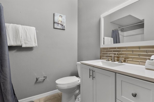 full bath with tile patterned flooring, curtained shower, baseboards, toilet, and vanity