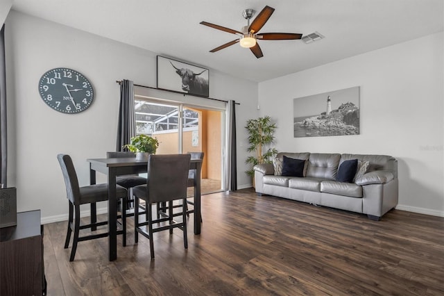 dining space with visible vents, baseboards, ceiling fan, and wood finished floors