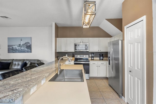 kitchen with visible vents, backsplash, light tile patterned floors, appliances with stainless steel finishes, and a sink