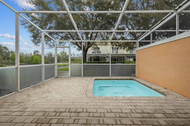 view of pool featuring a patio and a lanai