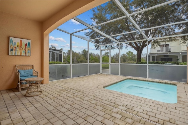 view of pool with a lanai and a patio area