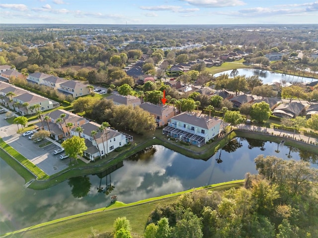 birds eye view of property with a residential view and a water view