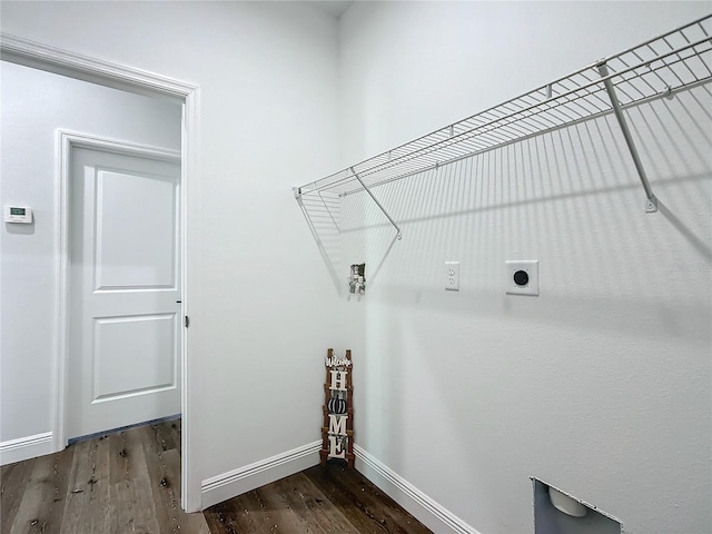 washroom featuring laundry area, wood finished floors, electric dryer hookup, and baseboards