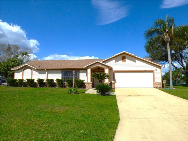 ranch-style house featuring a garage, driveway, a front lawn, and brick siding