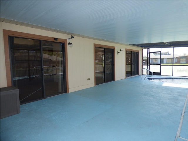 interior space with an indoor pool and a lanai