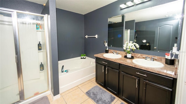 full bath featuring double vanity, a stall shower, a sink, tile patterned flooring, and a bath