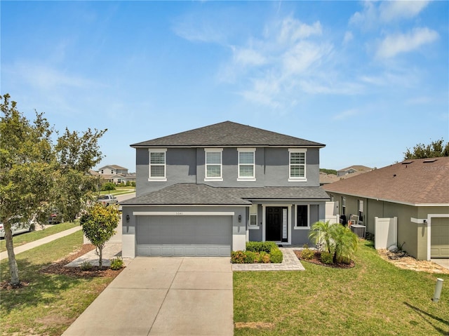 5640 Silver Thistle Ln, Saint Cloud, FL 34772 - traditional-style home featuring stucco siding, driveway, a front yard, and roof with shingles