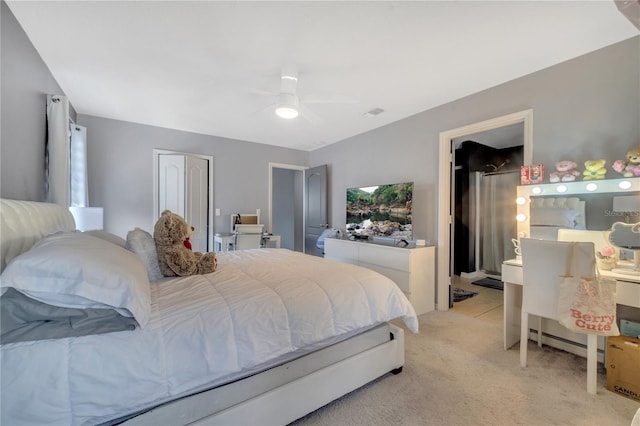 5640 Silver Thistle Ln, Saint Cloud, FL 34772 - bedroom with light colored carpet, ceiling fan, and connected bathroom