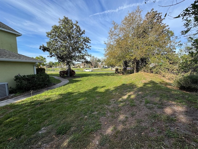 view of yard with central AC unit