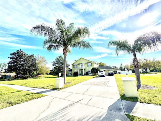 view of road featuring concrete driveway