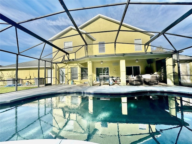 1201 Providence Blvd, Kissimmee, FL 34744 - outdoor pool with outdoor lounge area, a patio area, ceiling fan, and glass enclosure