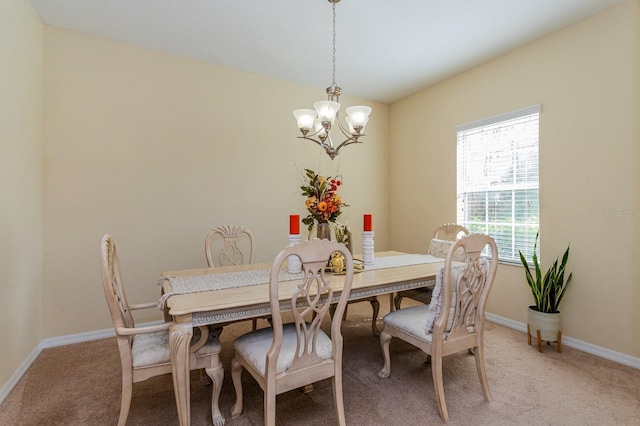 1000 Seburn Rd, Apopka, FL 32703 - dining room with a chandelier, light carpet, and baseboards
