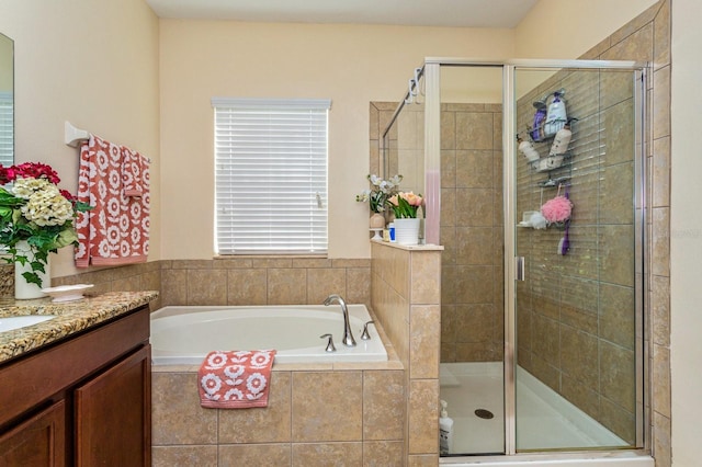 1000 Seburn Rd, Apopka, FL 32703 - bathroom featuring a shower stall, a garden tub, and vanity