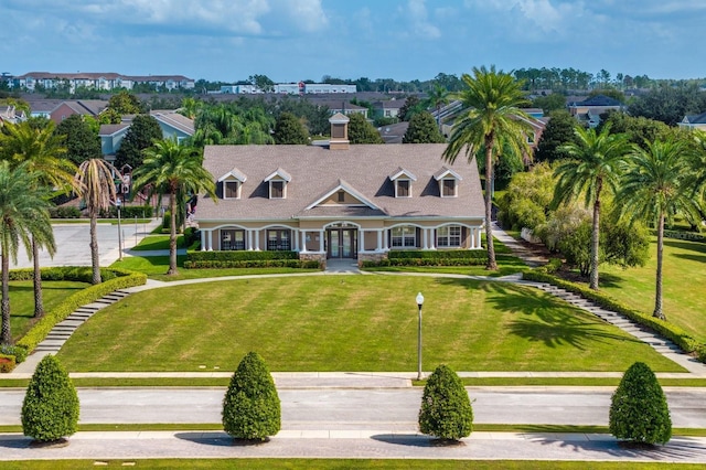 1000 Seburn Rd, Apopka, FL 32703 - new england style home with french doors, a chimney, and a front yard