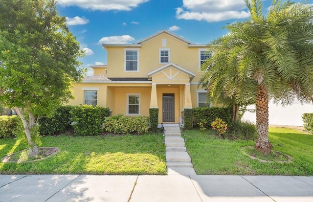 1000 Seburn Rd, Apopka, FL 32703 - view of front of house with stucco siding and a front yard