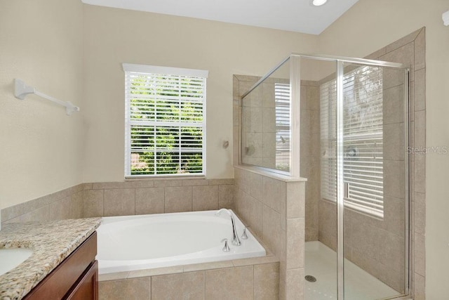 1000 Seburn Rd, Apopka, FL 32703 - full bathroom featuring a bath, vanity, and a shower stall