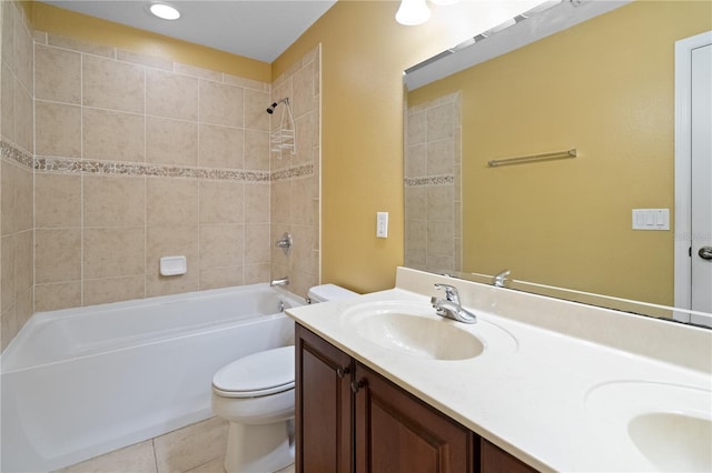 full bathroom featuring double vanity, shower / bathing tub combination, toilet, a sink, and tile patterned flooring