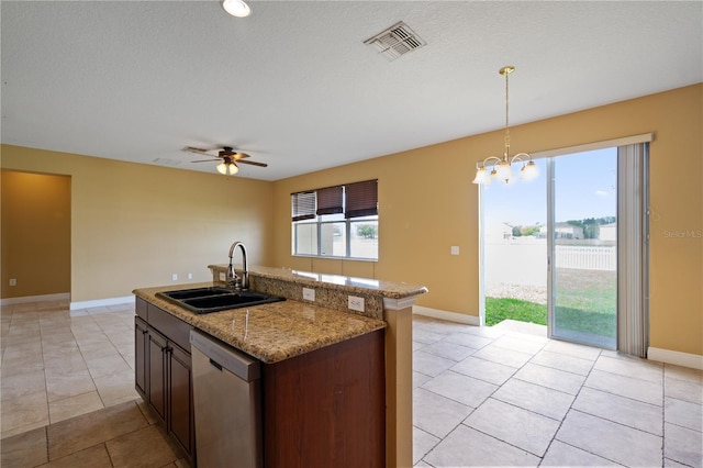 kitchen with ceiling fan with notable chandelier, a sink, visible vents, stainless steel dishwasher, and decorative light fixtures