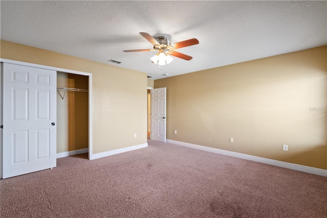 unfurnished bedroom with light carpet, a closet, visible vents, and baseboards