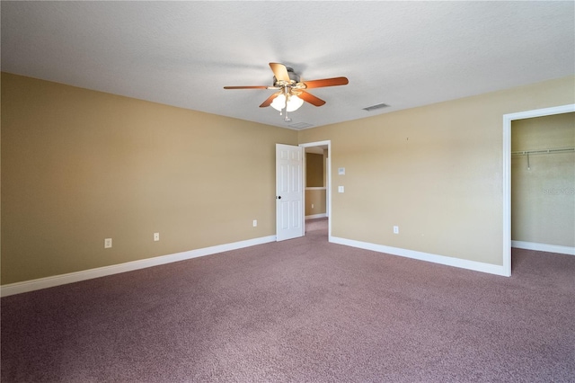 unfurnished bedroom with carpet, visible vents, and baseboards