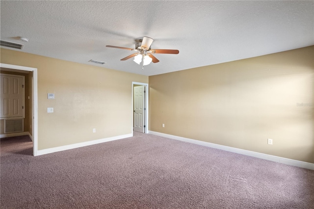 carpeted empty room with a textured ceiling, visible vents, and baseboards